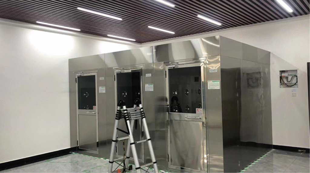 Cleanroom air shower system in operation with personnel undergoing decontamination